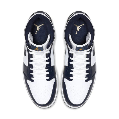 The Air Jordan 1 Mid 'White Metallic Gold Obsidian' features a classic two tone colourway of deep navy blue and clean white with matching white laces. Perfect for Men, this easy to style AJ1 Mid is available in UK7 - UK11 and fits true to size. Super comfortable and 100% authentic with stunning metallic gold Jumpman branding, we can understand the huge demand for these Jordan 1 Mid Obsidians. Shop them now at DoorstepDrip!