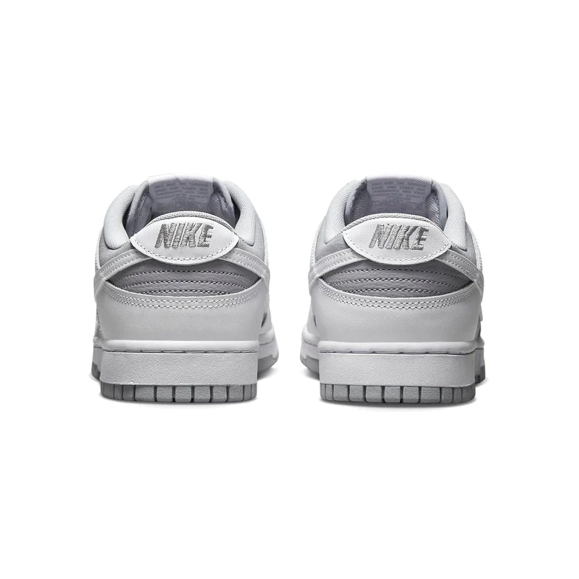 The Nike Dunk Low 'White Grey' features an inverted two tone color blocking of white and grey with a white swoosh upon grey underlays. Perfect for Men, this easy to style summer vibes Dunk Low is available in UK7 - UK11 and fits true to size. Super comfortable and 100% authentic we can understand the huge demand for these Nike Dunk Low White Greys. Shop them now at DoorstepDrip!